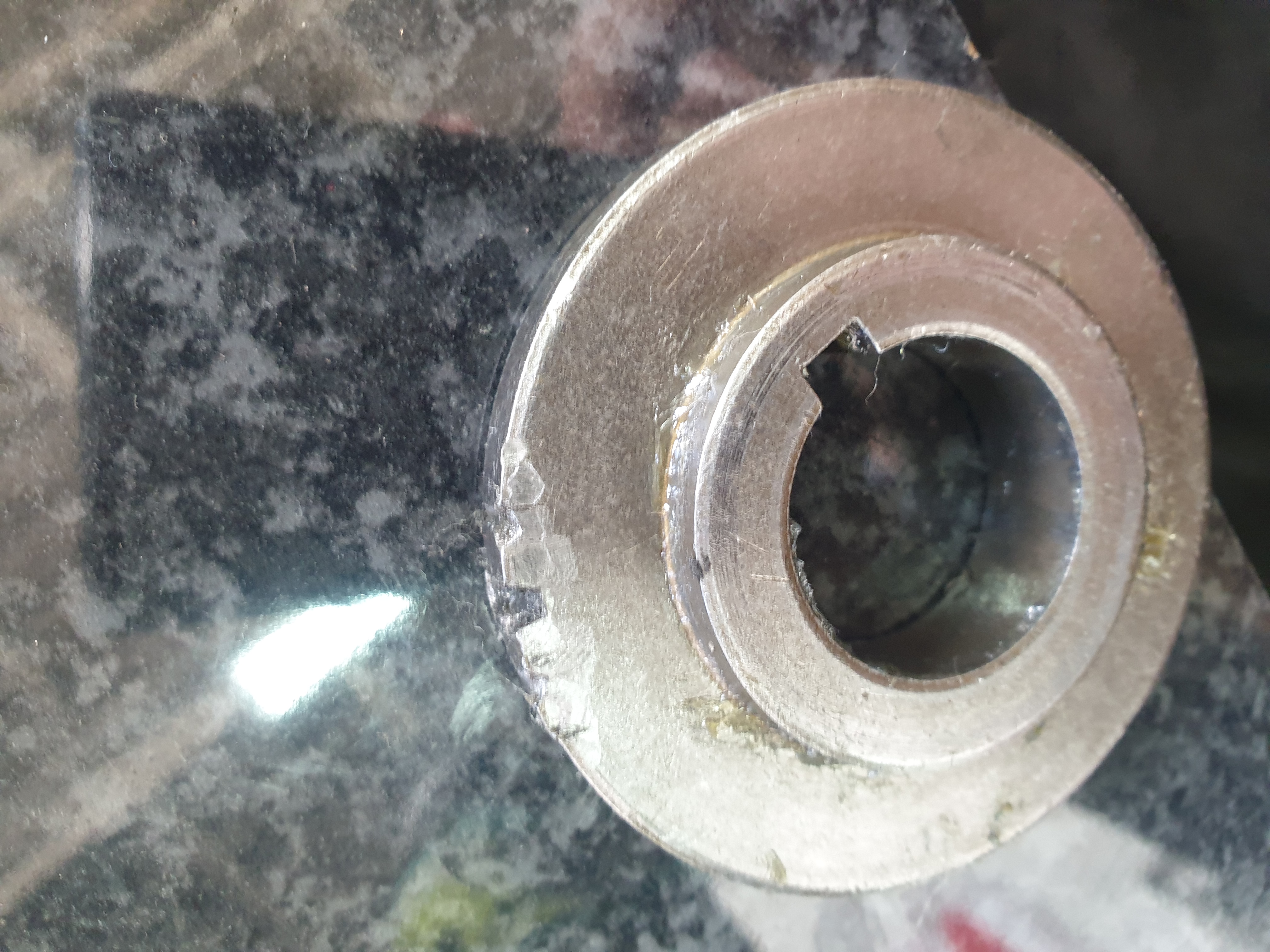 Close-up of mixer shaft and gear wear during rebuild inspection