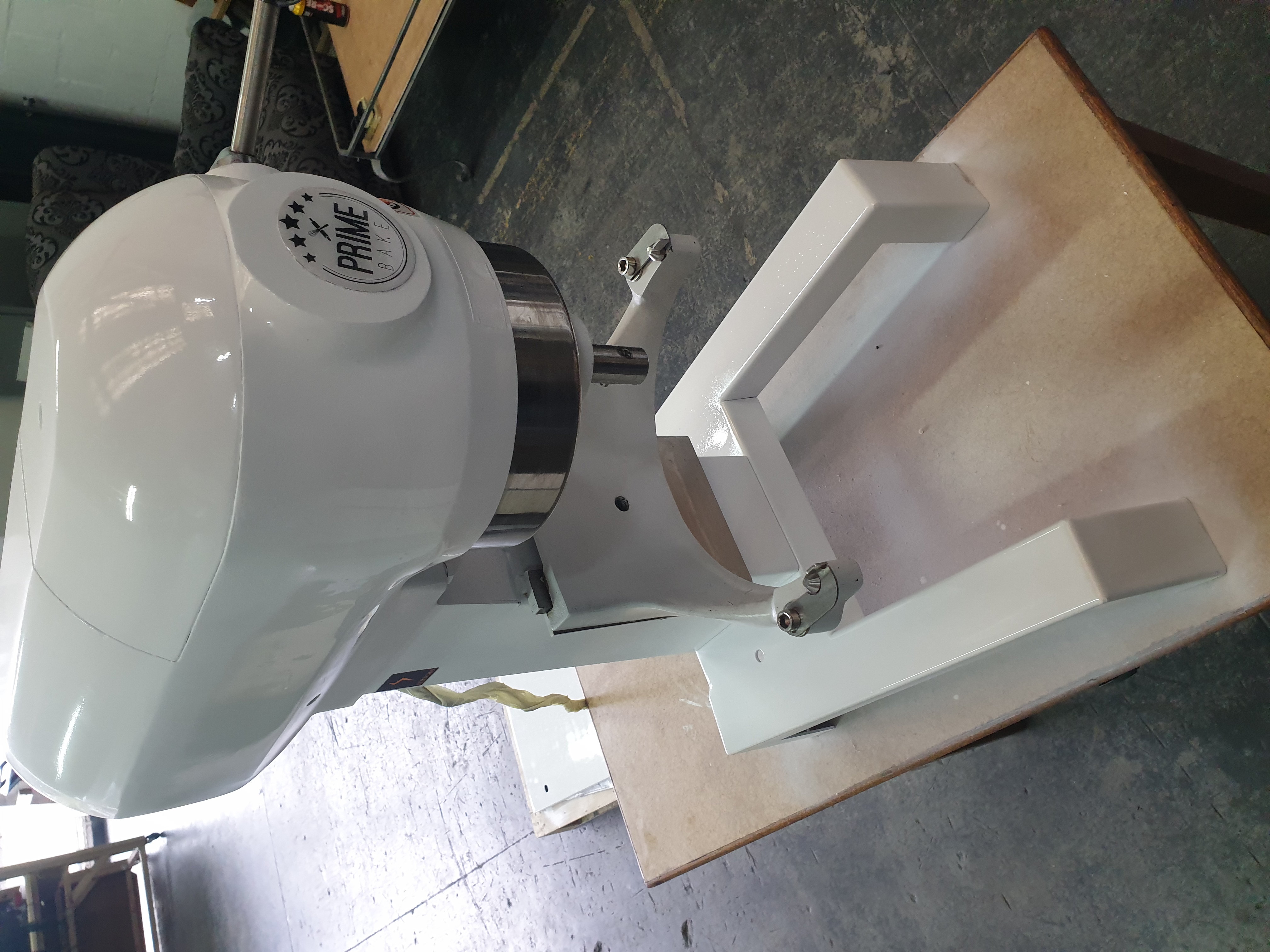 Refurbished commercial mixer showing restored body finish and repaired mechanical assembly