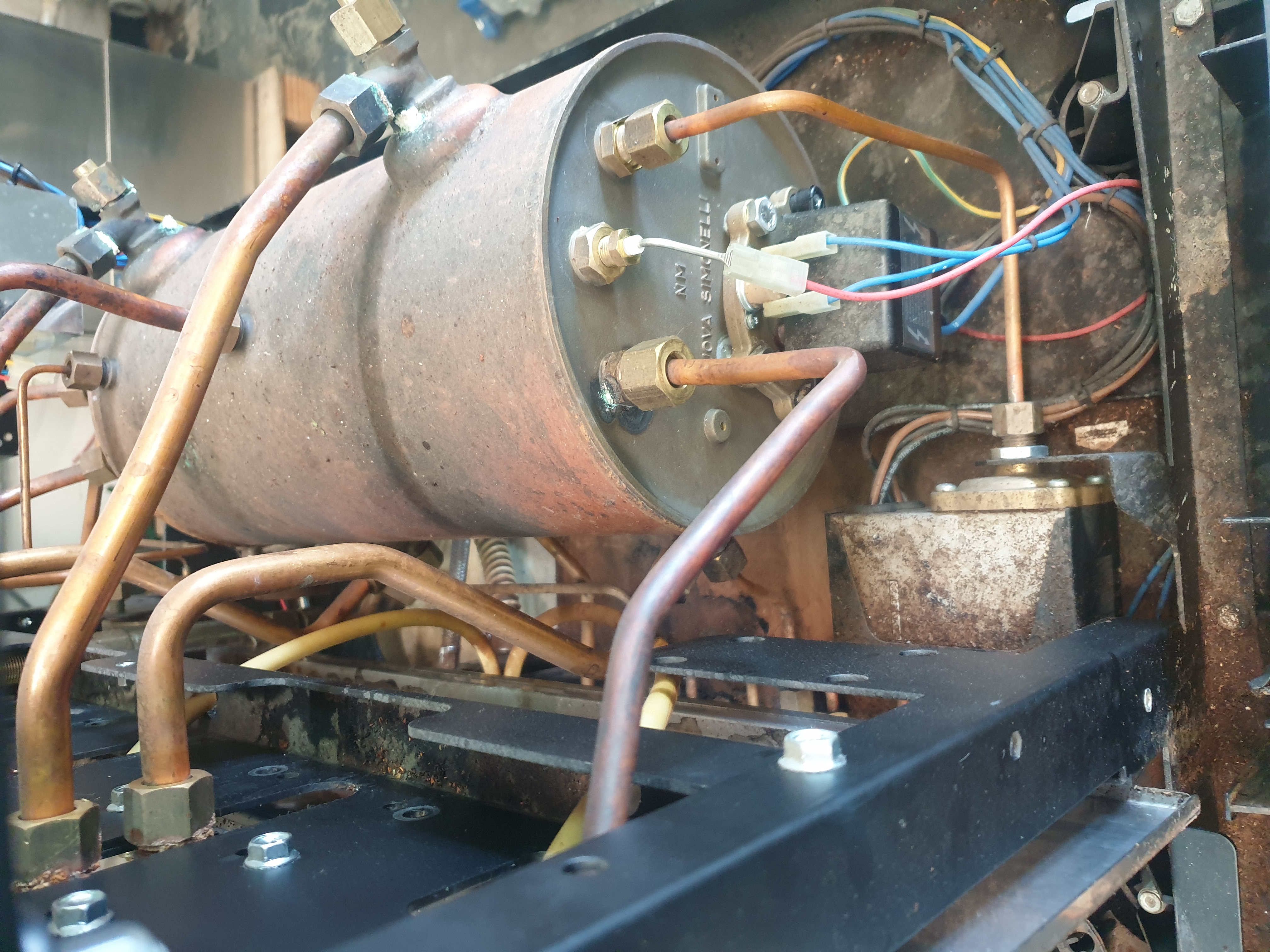 Coffee machine internal wiring boiler and plumbing during repair