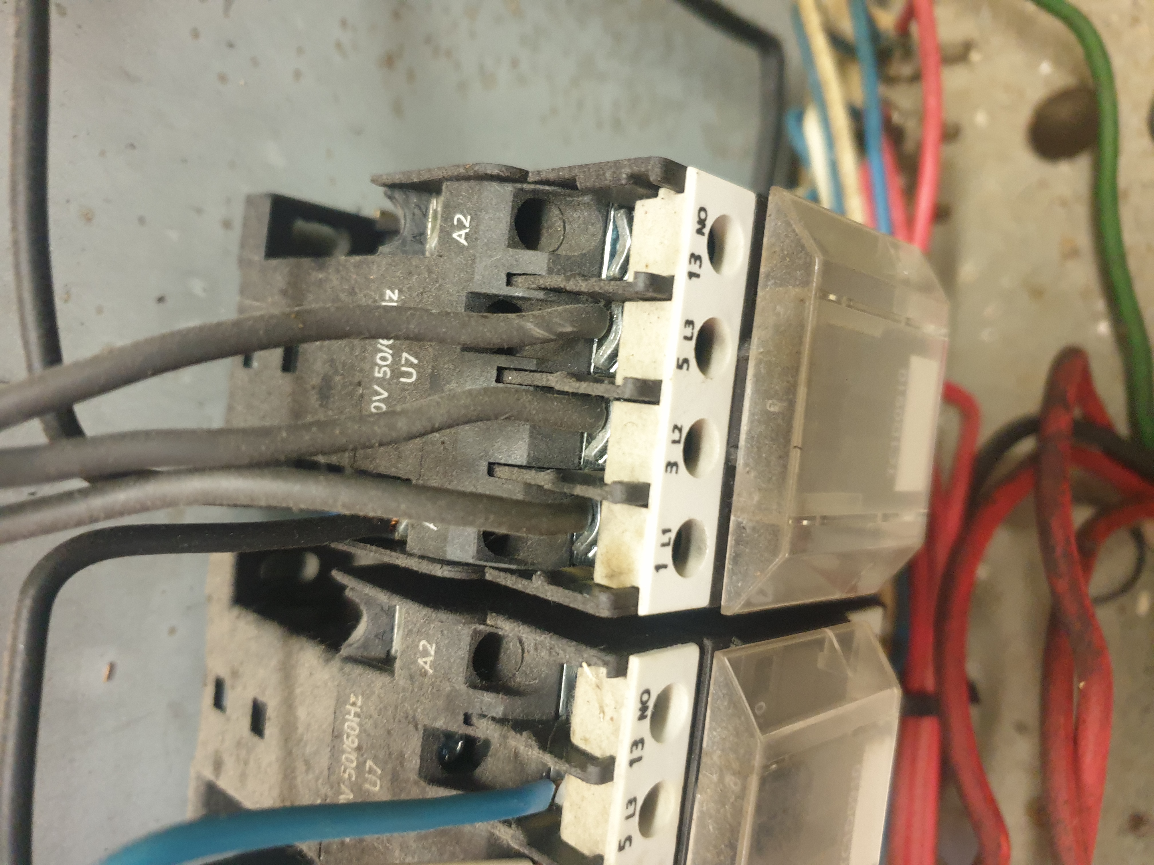 Commercial cooking equipment contactor close-up during electrical repair