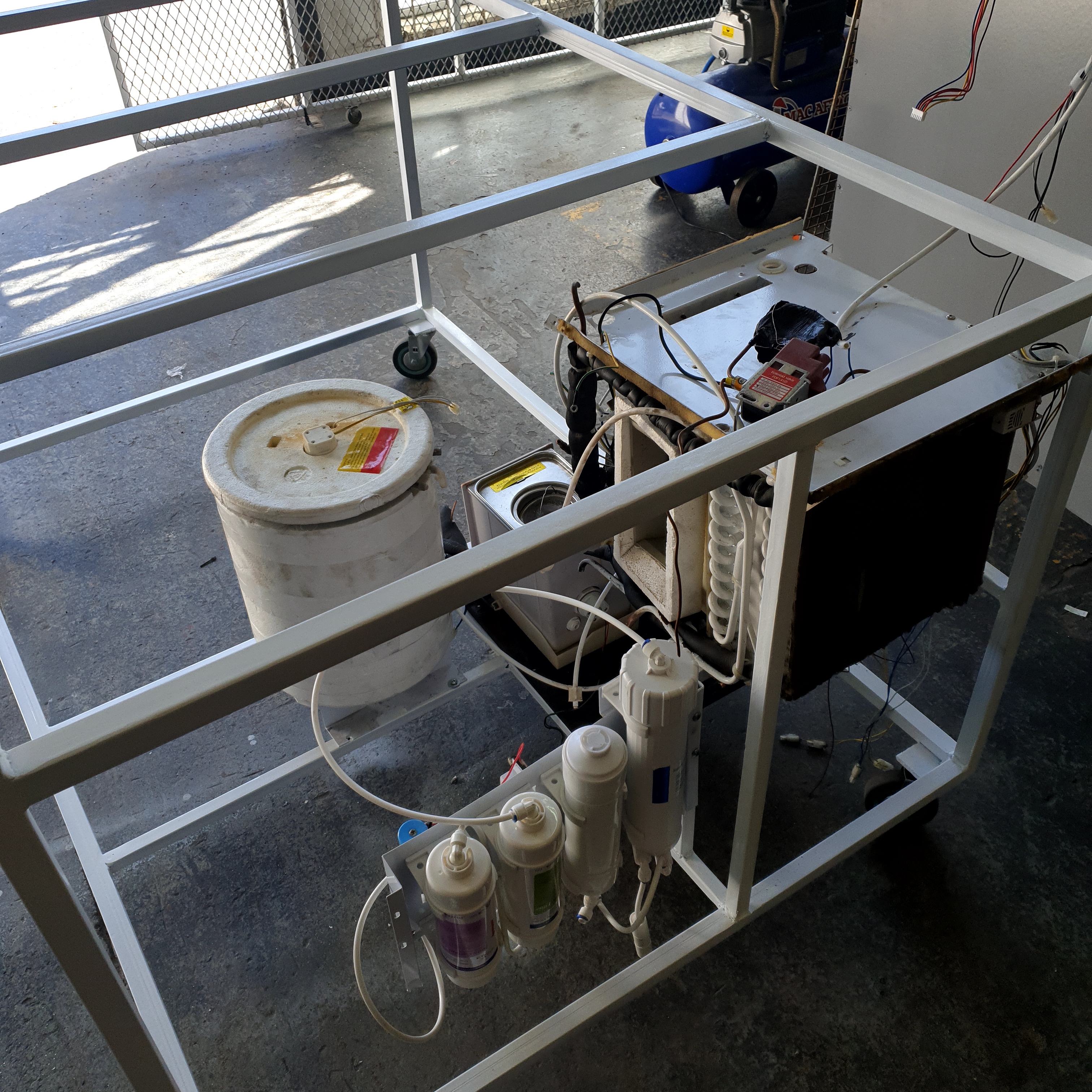 Custom chocolate spray booth frame and internal components during the build
