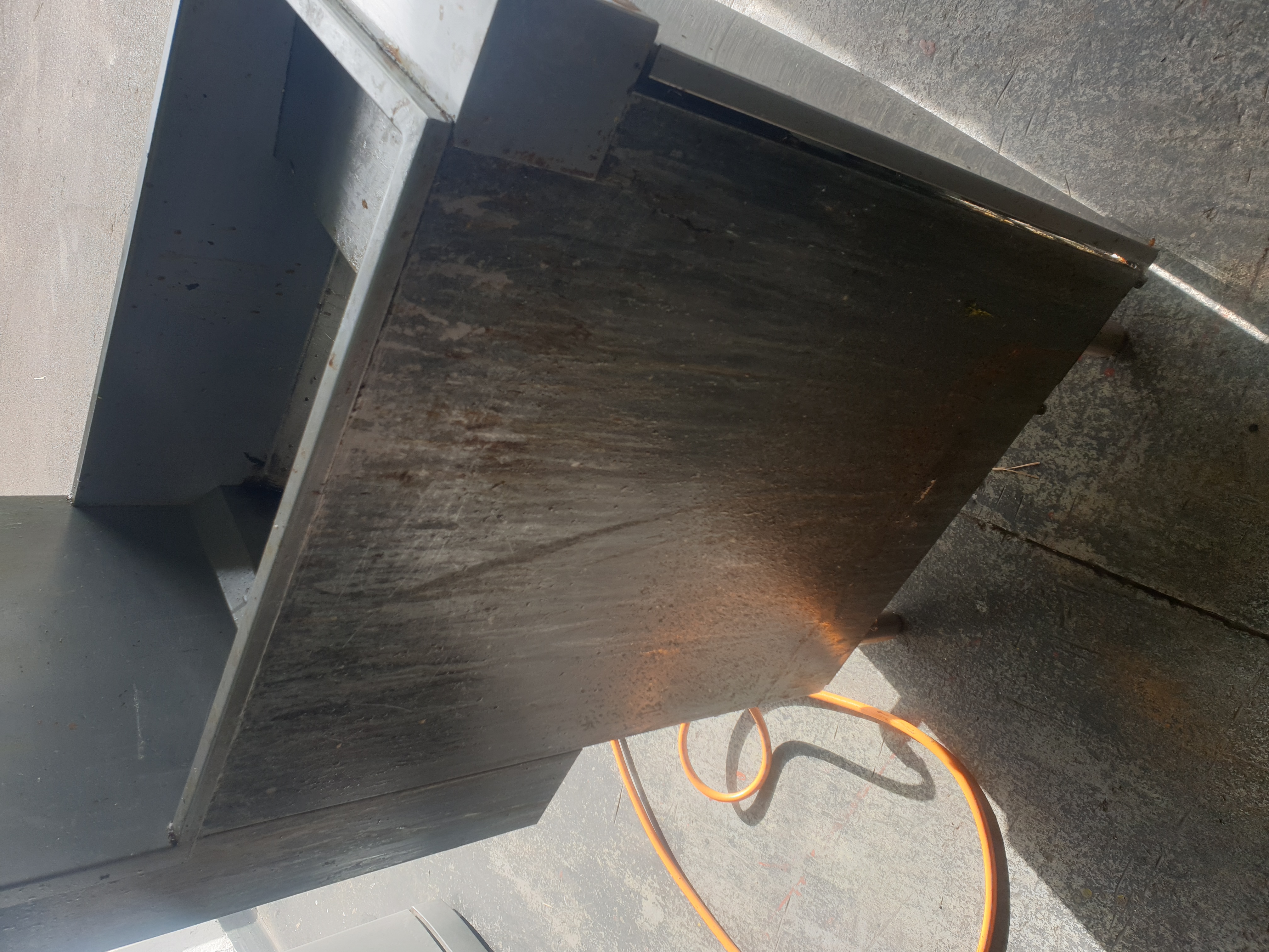 Commercial gas fryer cabinet during repair assessment