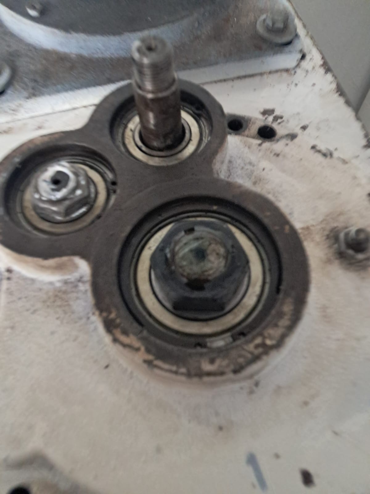 Close-up of Macadams mixer bearings and shaft during service