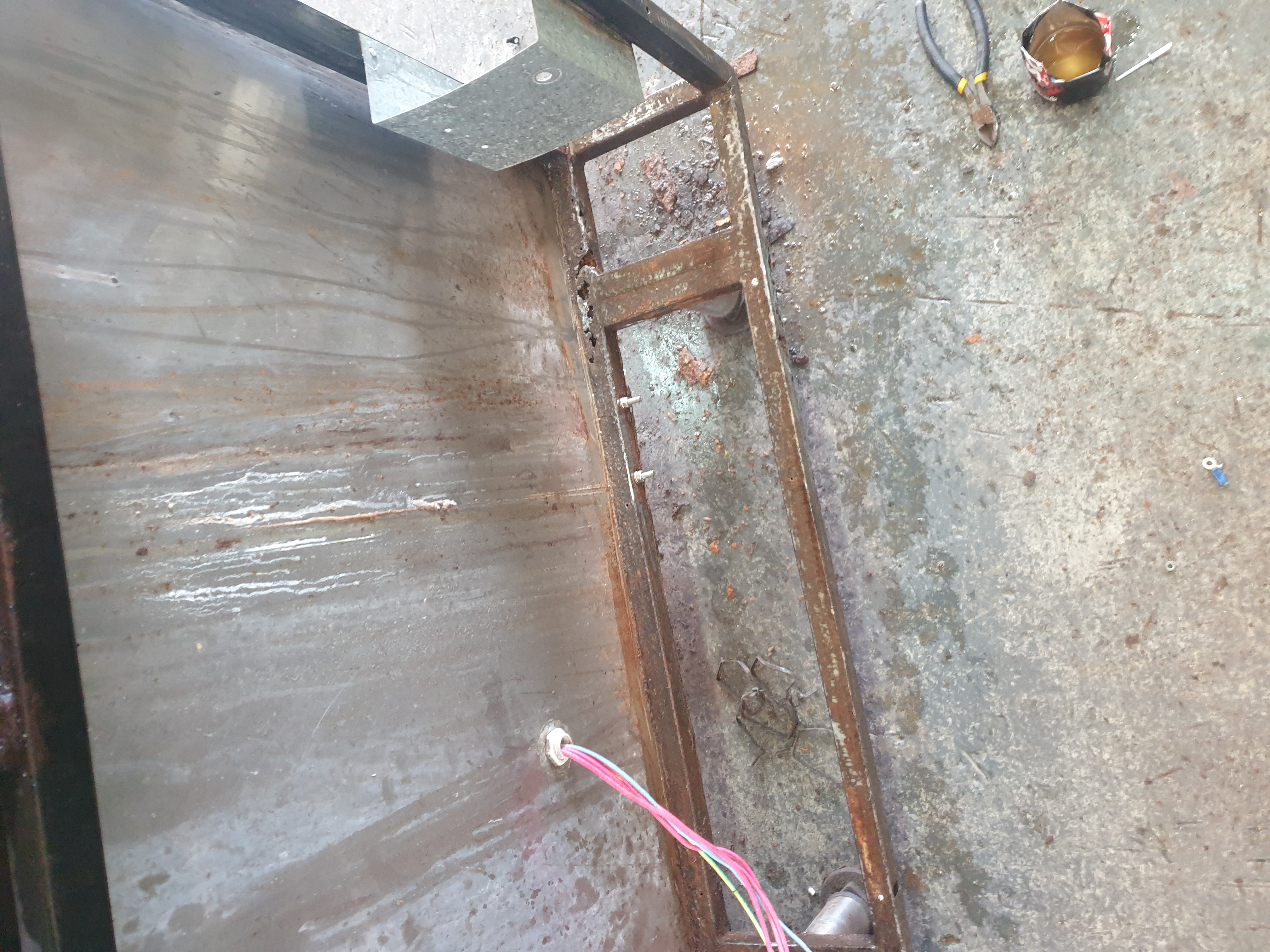 Tilt pan frame and stainless panel work during custom fitting