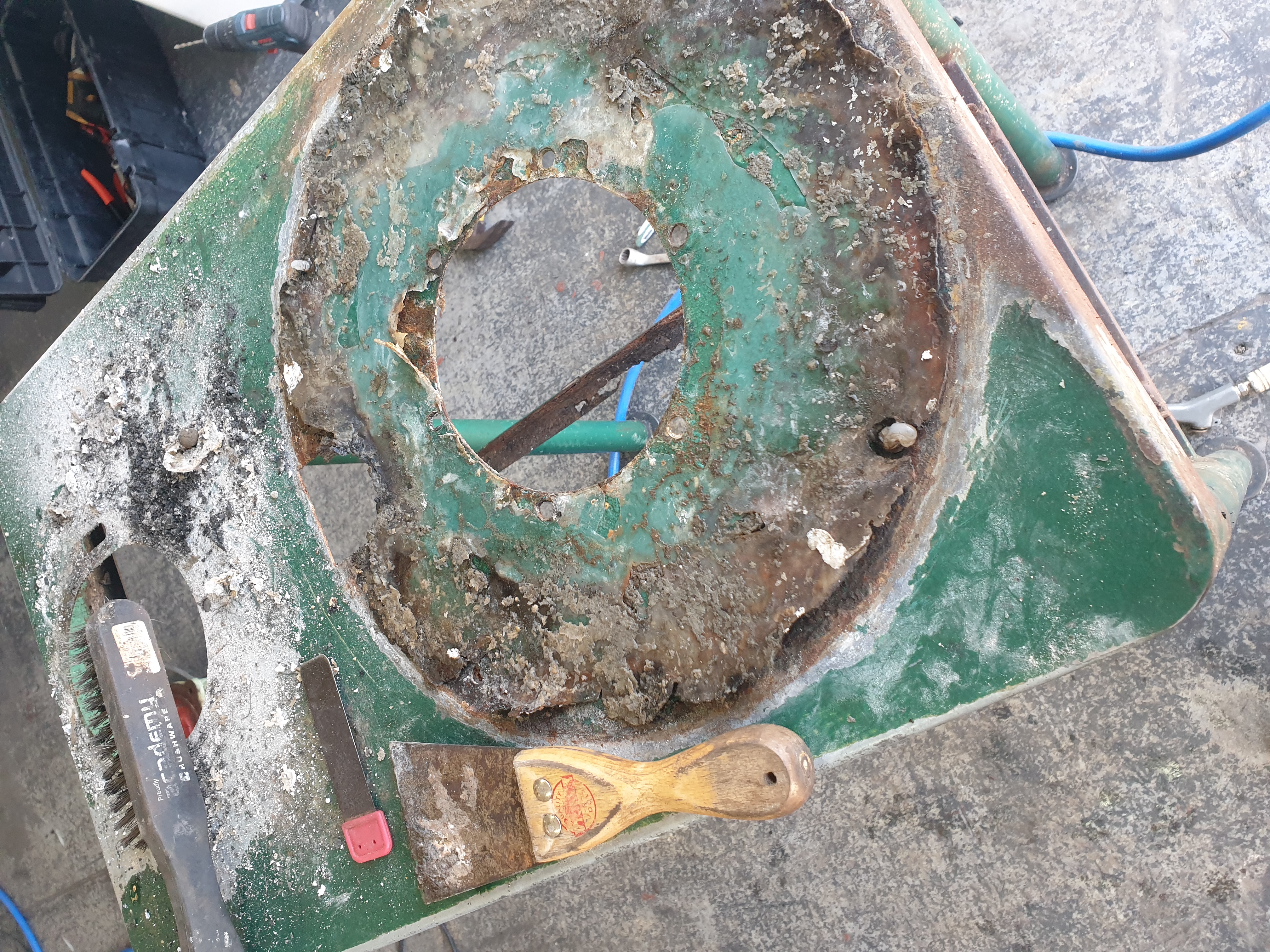 Heavy residue and corrosion inside potato peeler body before cleaning