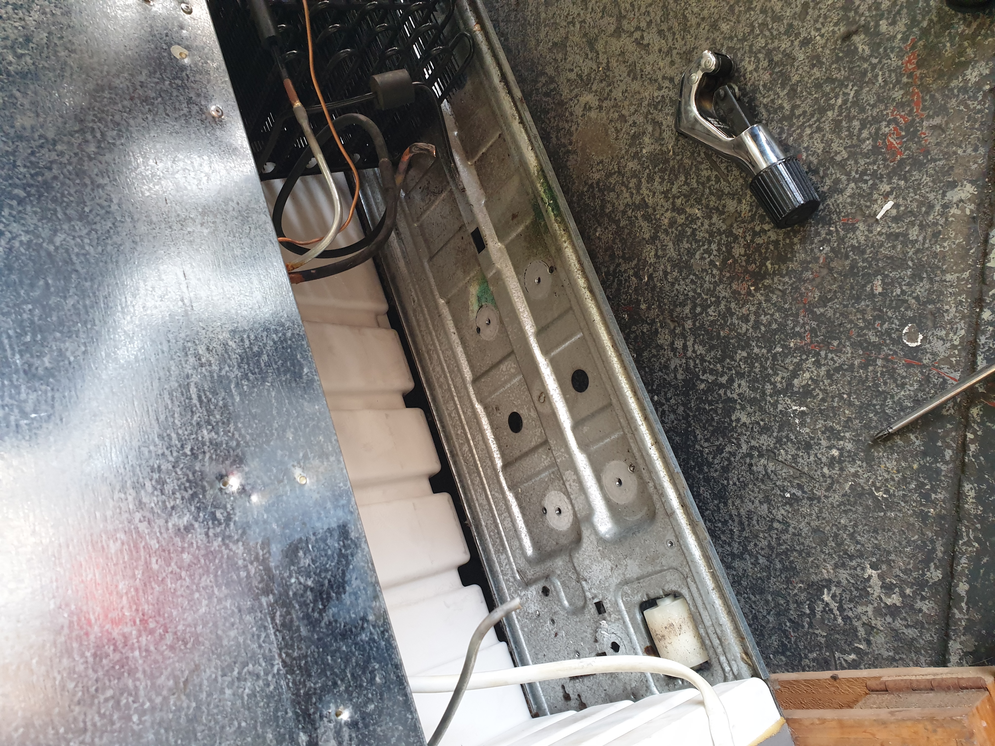 Side-by-side fridge compressor bay before the R600a compressor change out