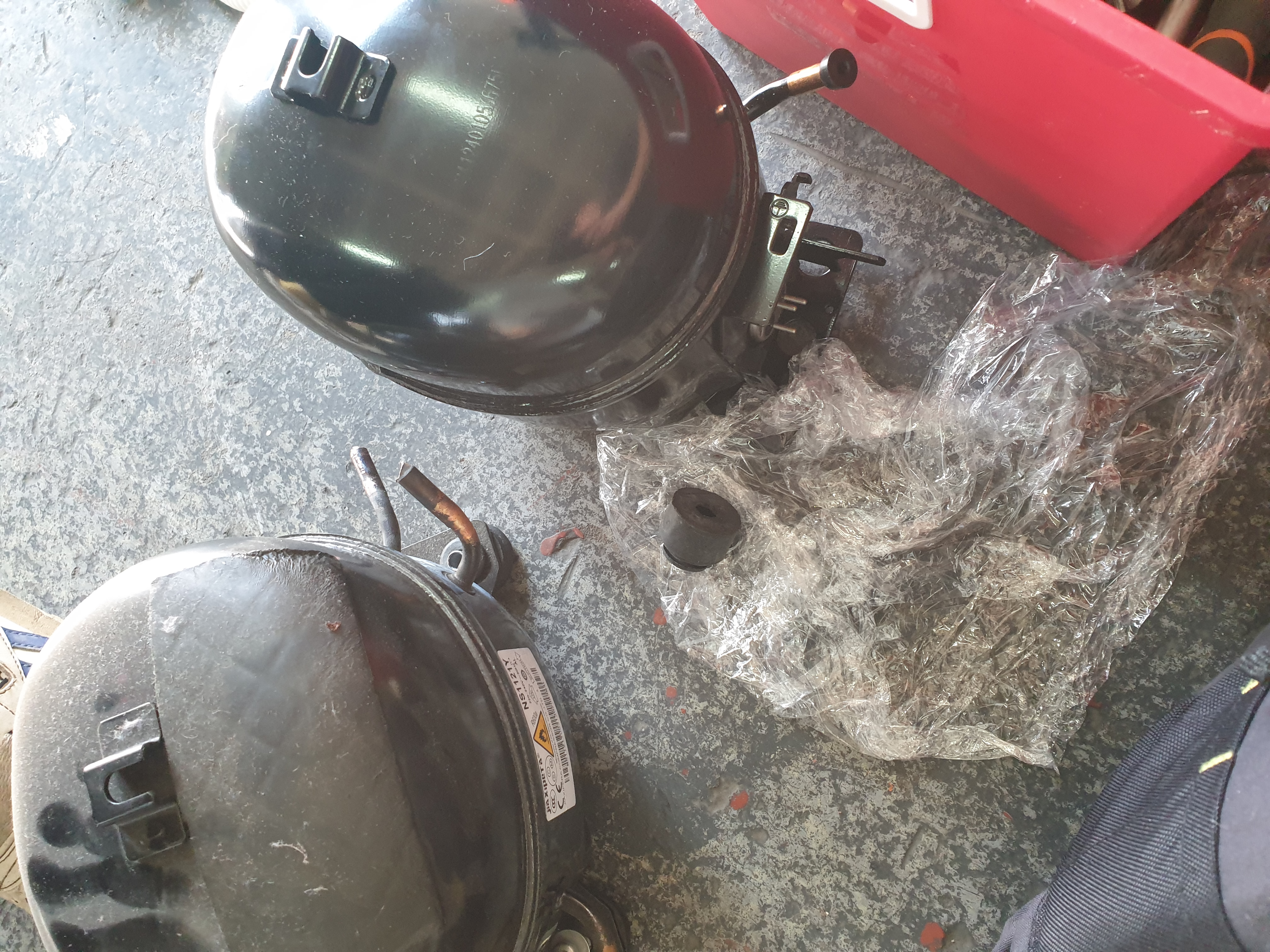 Side-by-side fridge sealed-system compressor change out in progress