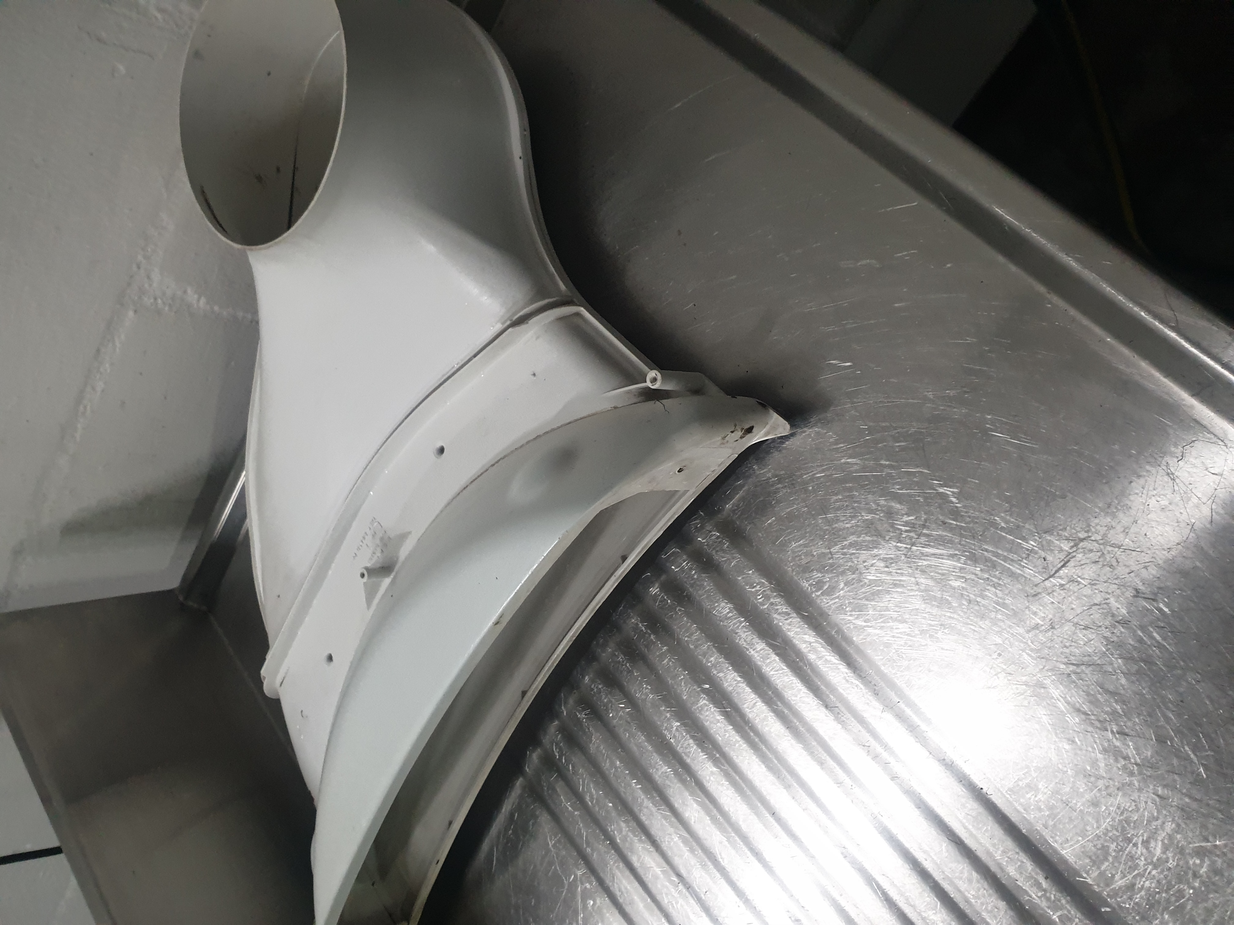 Speed Queen dryer blower housing removed for cleaning and inspection
