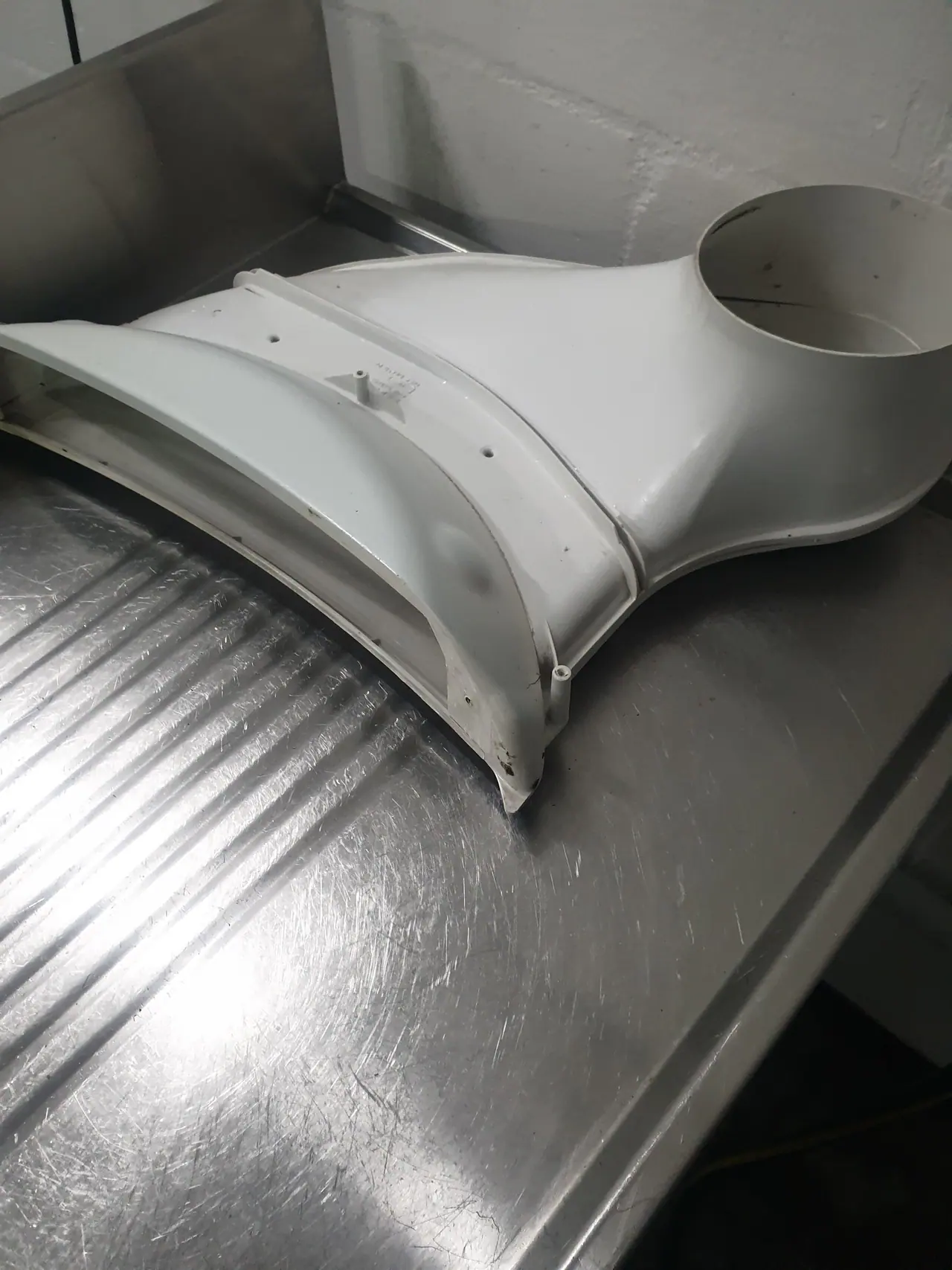 Speed Queen dryer blower housing removed for cleaning and inspection