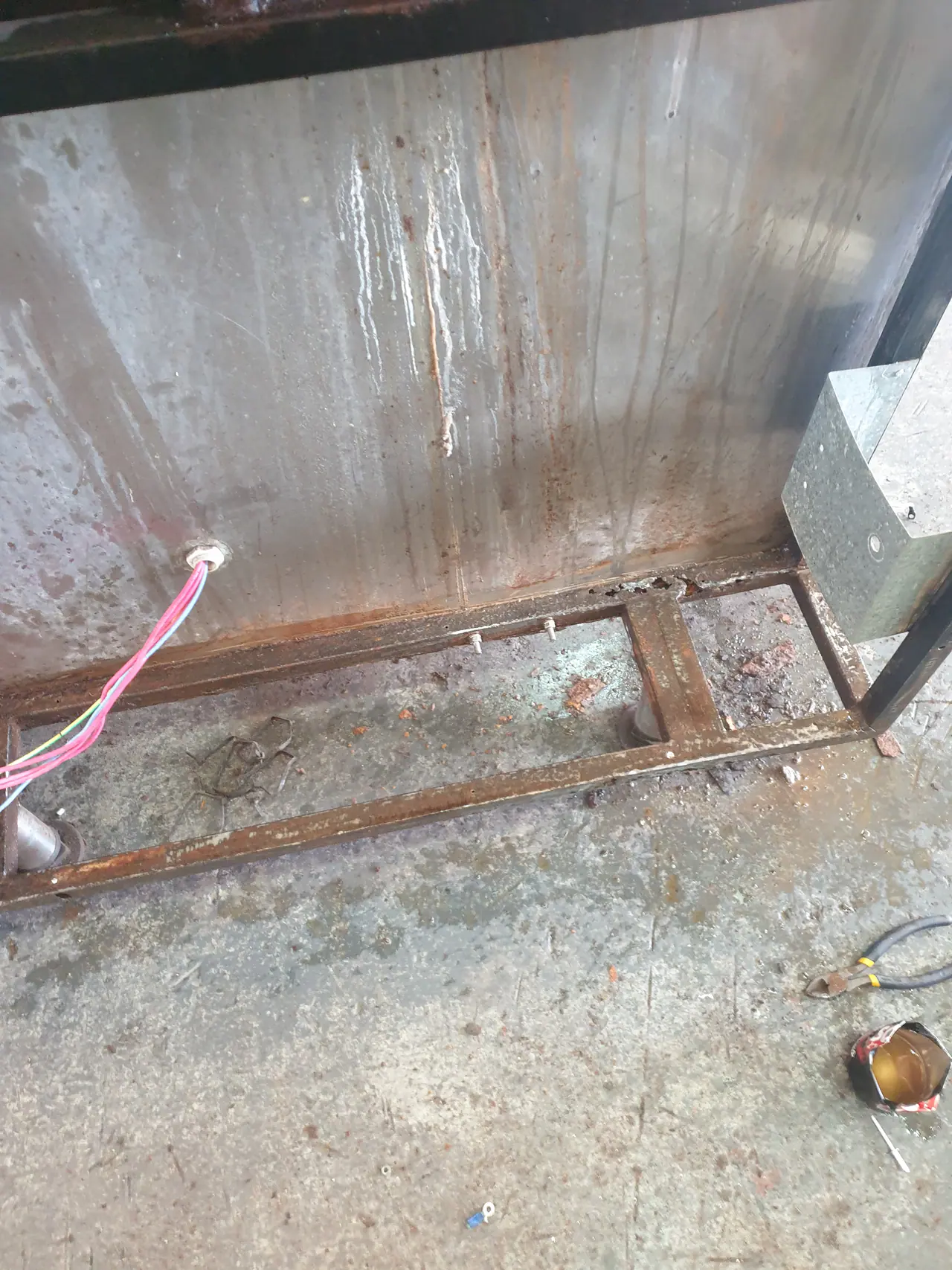 Tilt pan frame and stainless panel work during custom fitting