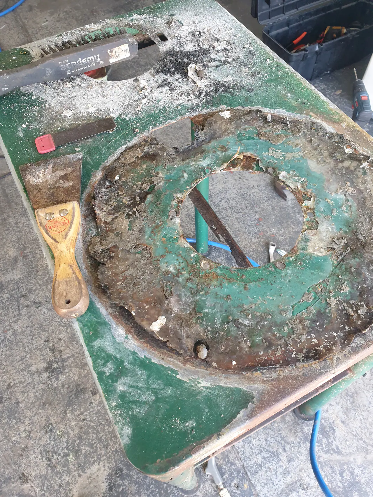 Heavy residue and corrosion inside potato peeler body before cleaning