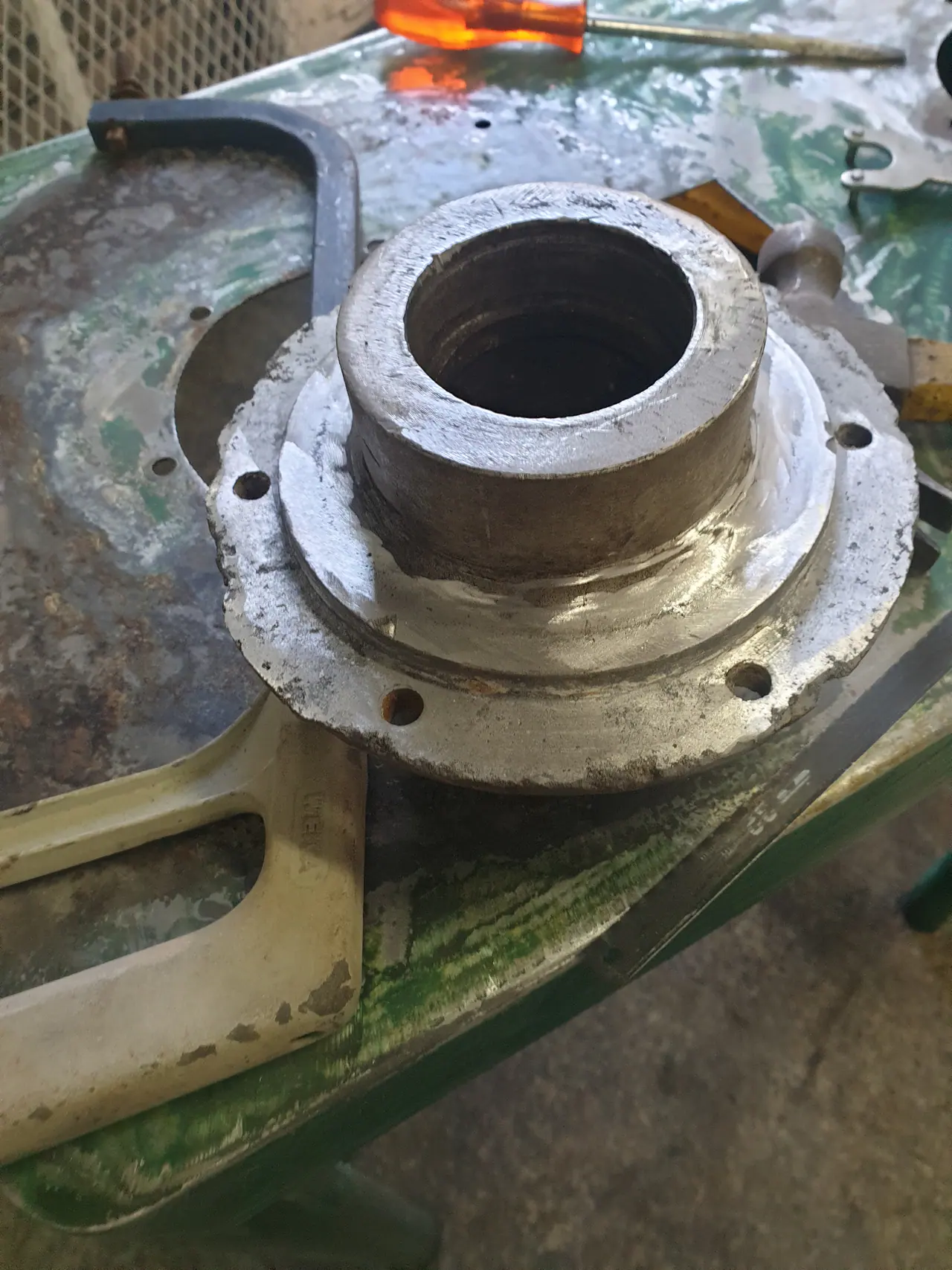 Potato peeler body prepared for repair and respray during rebuild